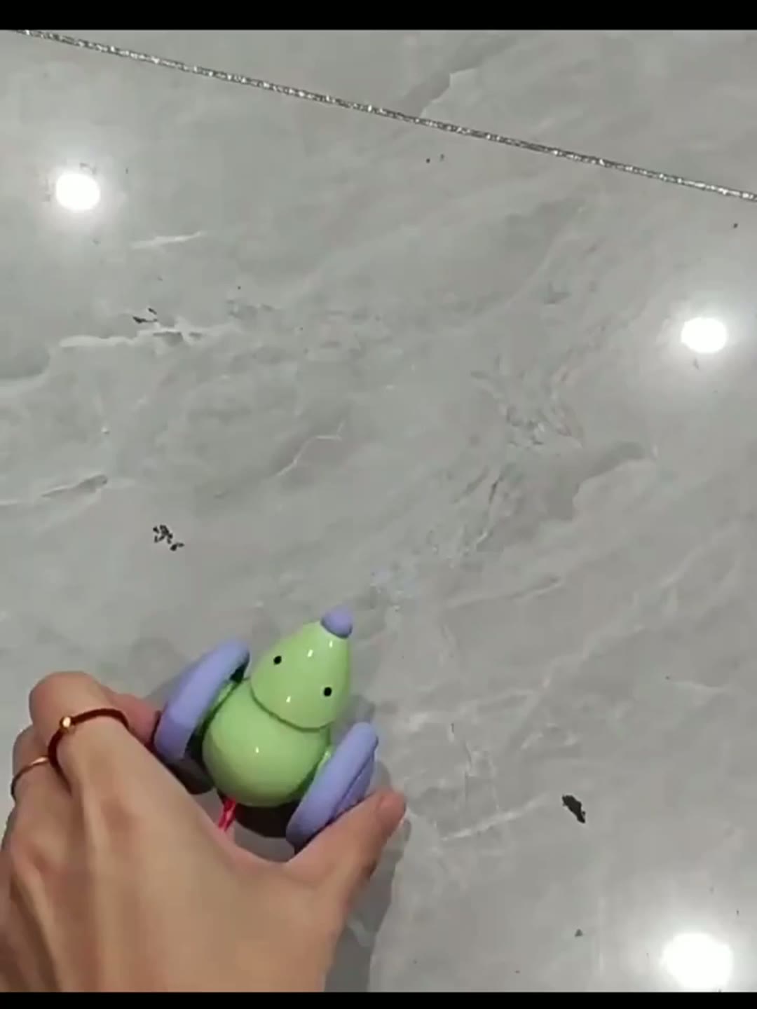PawPulse smart robotic mouse toy rolling across hardwood floor